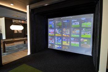 A screen shows a collection of video games at The Crest at South Point Apartments, Davenport , GA